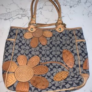 Coach bag with flower design.